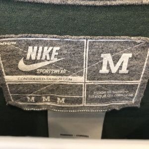 Nike Shirts - Nike Sportswear Miami Hurricanes Helmet T-Shirt Nike Shirts - Nike Sportswear Miami Hurricanes Helmet T-Shirt